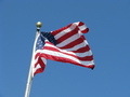 American Flag Waving in Clear Blue Sky FREE Stock Photo, american flag,  patriotism,  national pride picture
