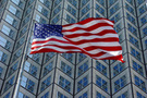 American flag against modern glass building FREE Stock Photo, america, flag, usa picture