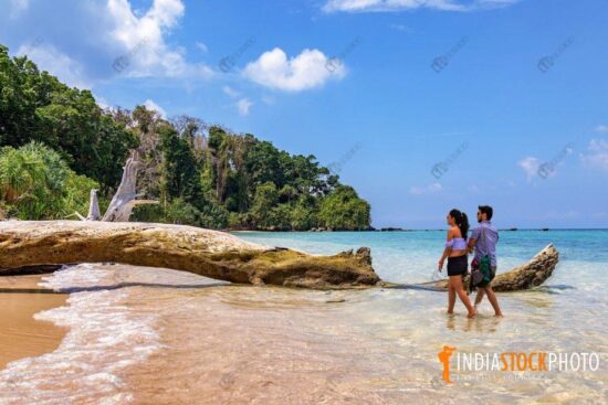 Couple enjoy walk at the scenic Jolly Buoy island at Andaman