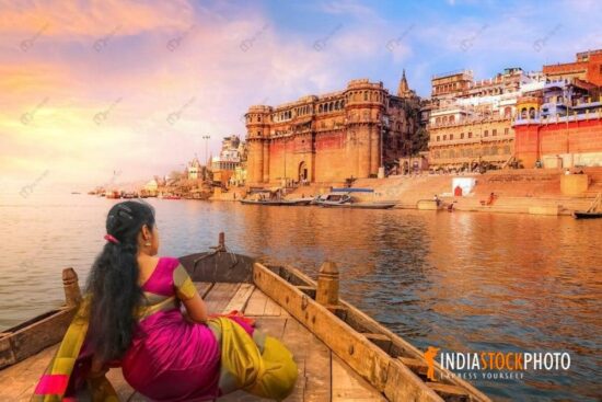 Woman tourist enjoy boat ride at Varanasi Ganges