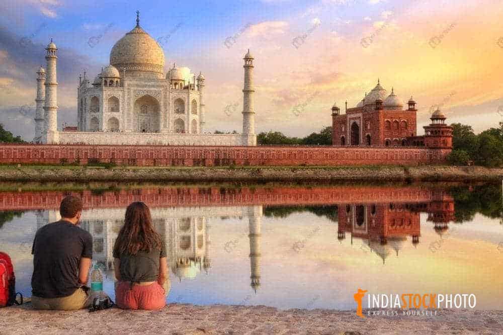 Couple enjoy Taj Mahal Agra at sunset from Mehtab Bagh