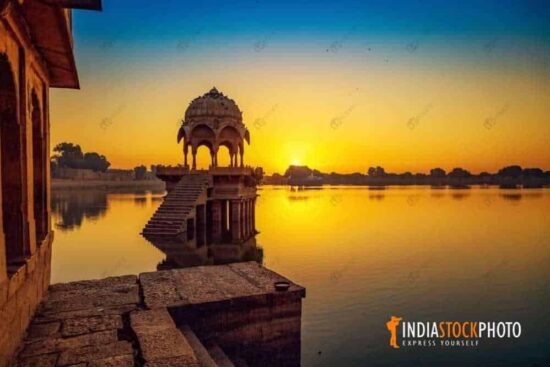 Ancient architecture Gadisar Lake Jaisalmer at sunrise
