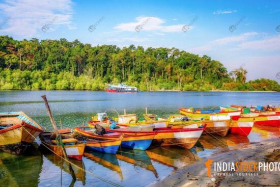 Tourist boats lined up at Jolly Buoy island sea beach at Andaman