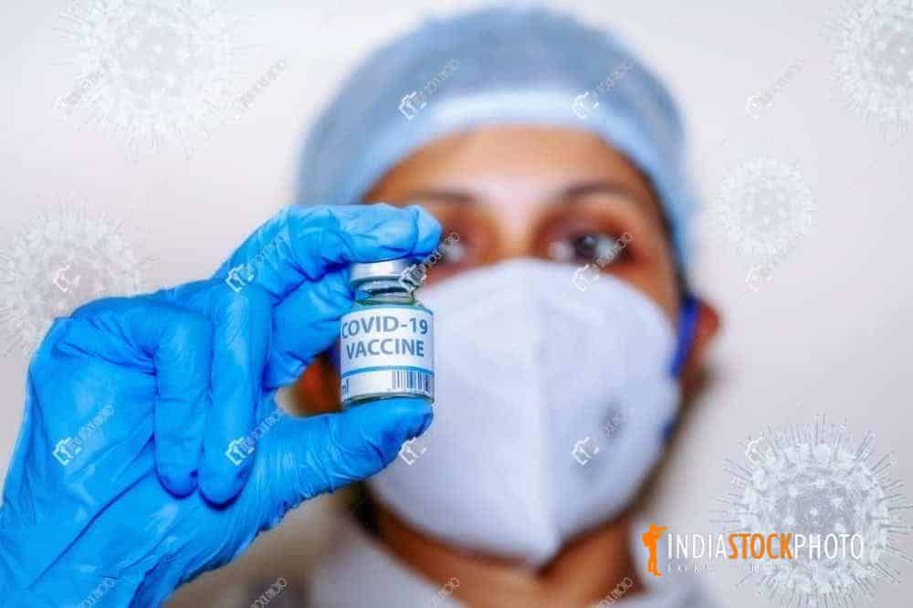 Indian nurse hold a Covid-19 vaccine conceptual image