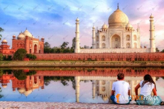 Couple enjoy view of Taj Mahal Agra at sunset
