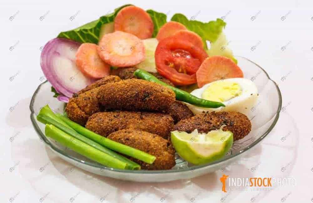 Crispy fried fish fingers served with salad