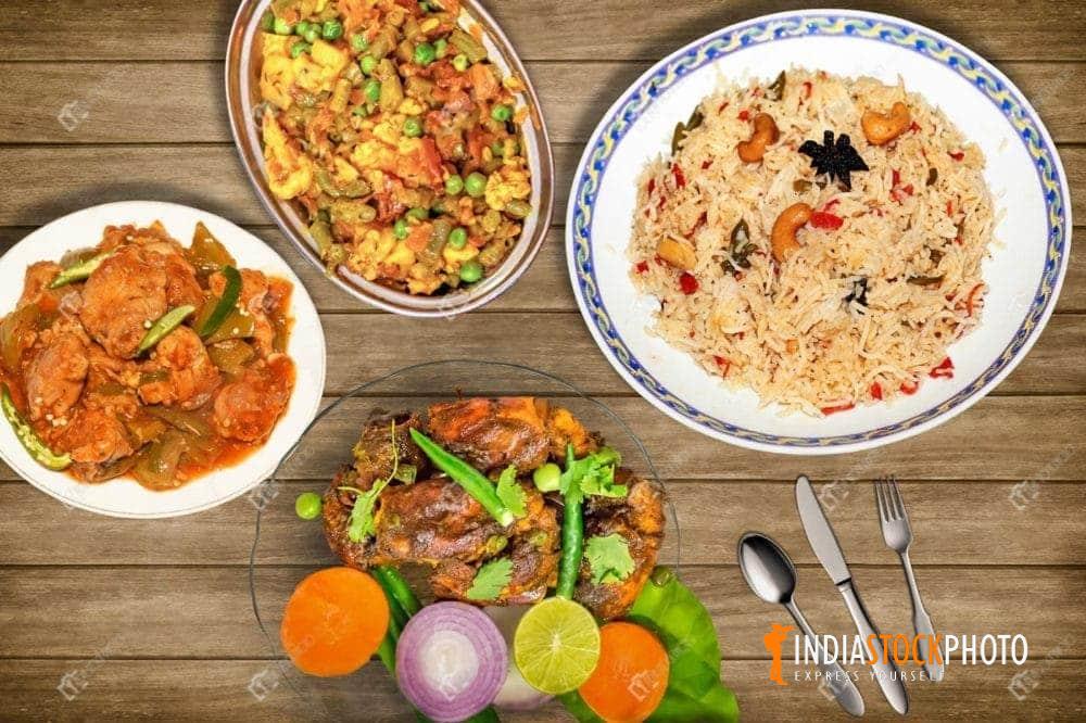 Indian cuisine of mixed fried rice with chili chicken and prawn