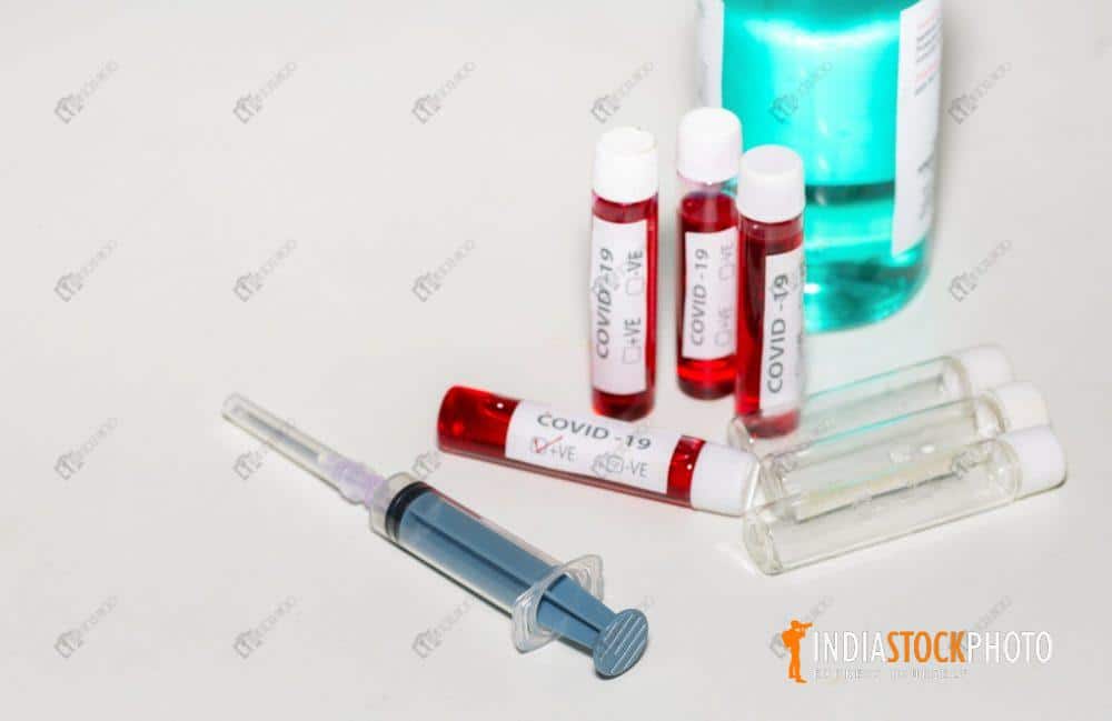 Injection syringe with blood sample vials and medicines
