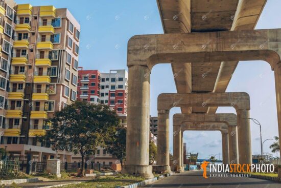 Under construction city flyover with residential building apartments