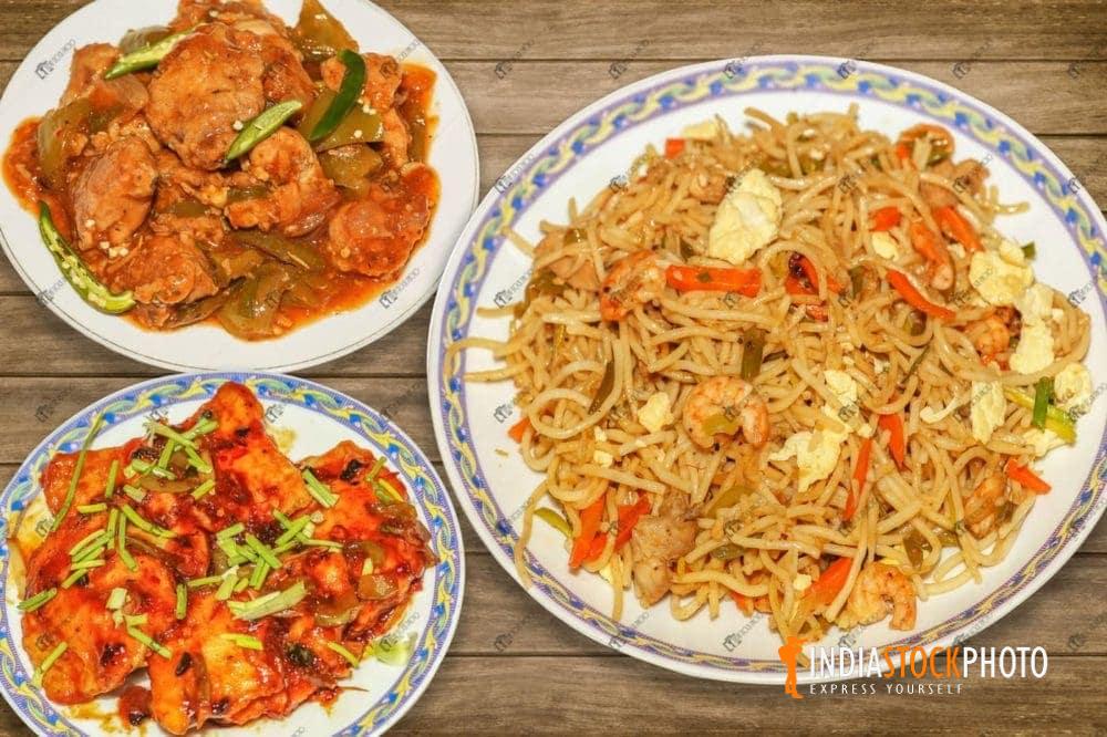 Delicious Chinese cuisine of mixed chowmein with chicken side dish