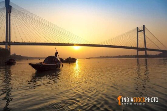 Boats on river Ganges near Vidyasagar (Setu) bridge Kolkata at sunset