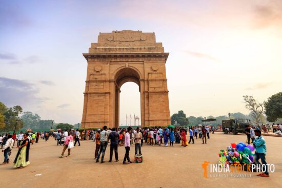 India Gate New Delhi with tourists at sunset