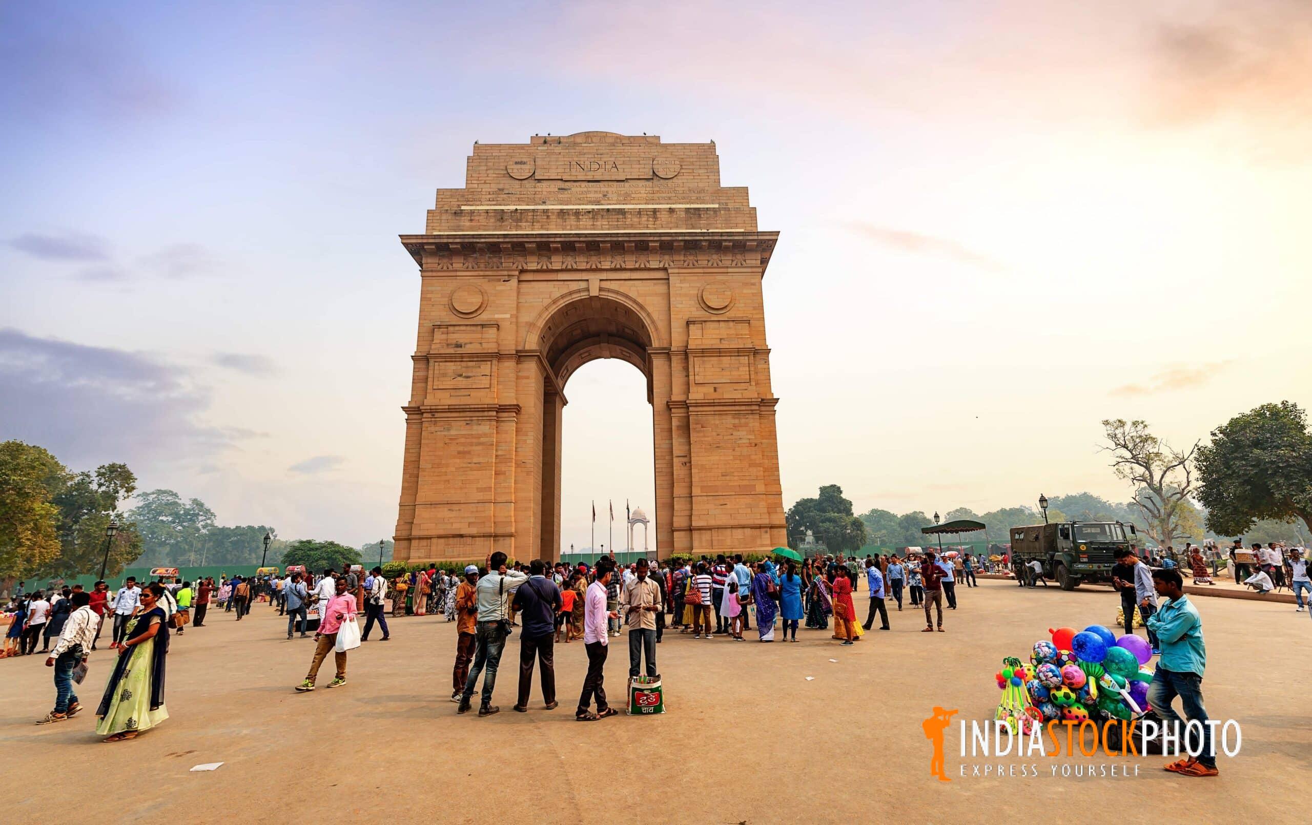 India Gate New Delhi with tourists at sunset