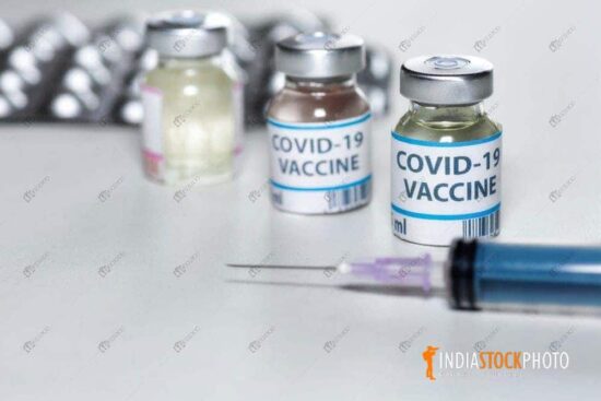 Coronavirus vaccine bottles with injection syringe
