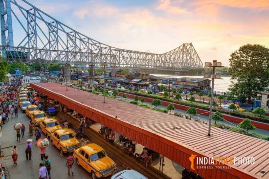 Howrah bridge Kolkata with aerial view of taxi stand at sunset