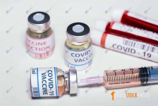 Injection syringe with vaccine bottles and blood sample vials