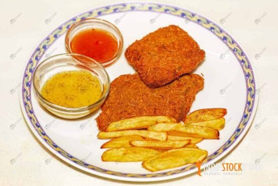 Crispy fish fry with French fries served with tomato and mustard sauce
