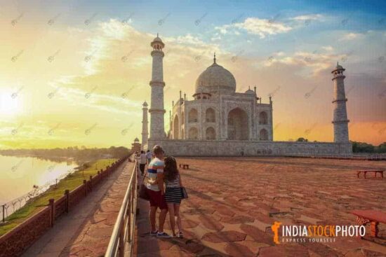 Tourist at iconic Taj Mahal Agra India at sunset