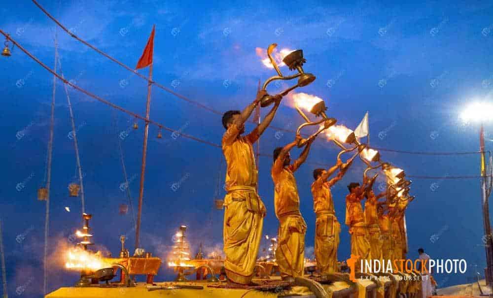 Young priests perform holy Ganga aarti rituals at Assi ghat Varanasi