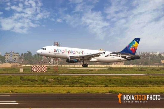 Passenger airplane landing on a runway at Kolkata airport
