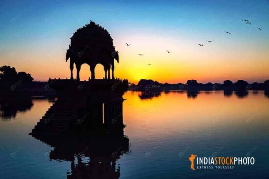 Gadisar Lake ancient architecture in silhouette at sunrise