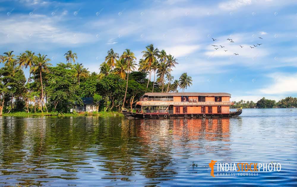 Kerala backwater with tourist houseboat
