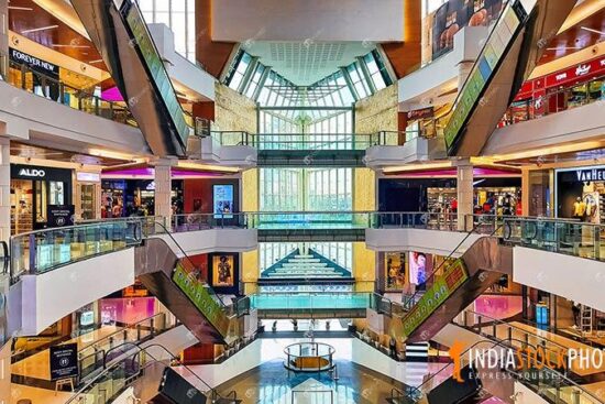 Modern city shopping mall interior view with brand stores