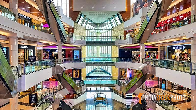 Modern shopping mall interior view with stores on different floors