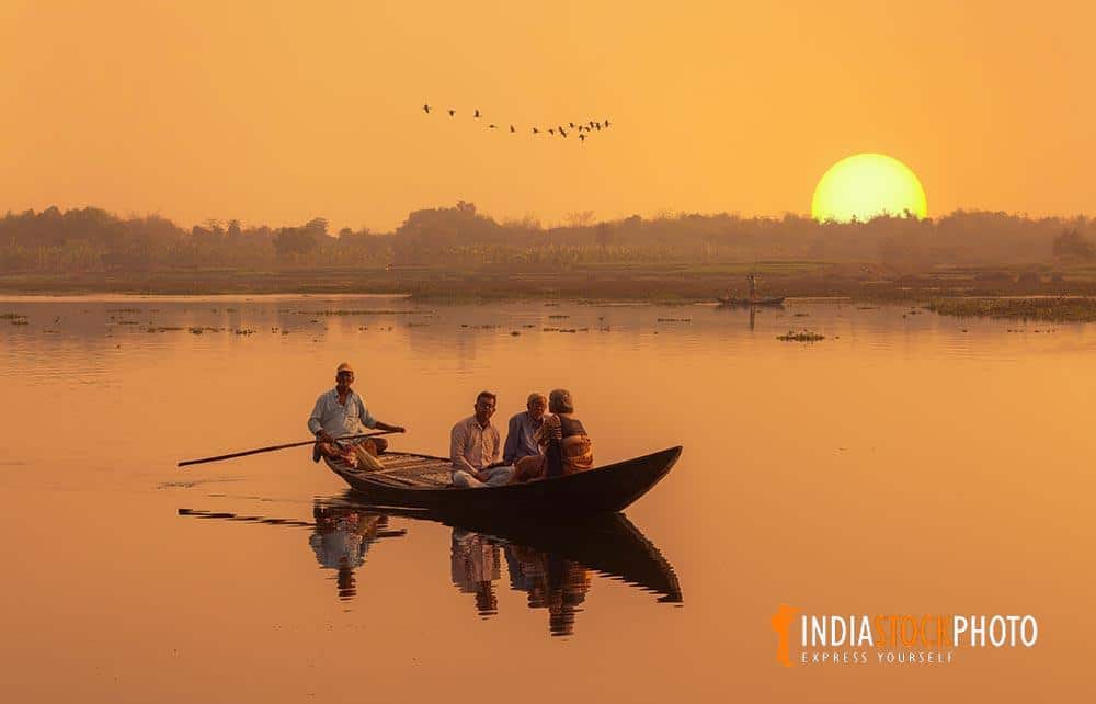 Tourist enjoy boat ride on river Ganges at sunset at West Bengal India